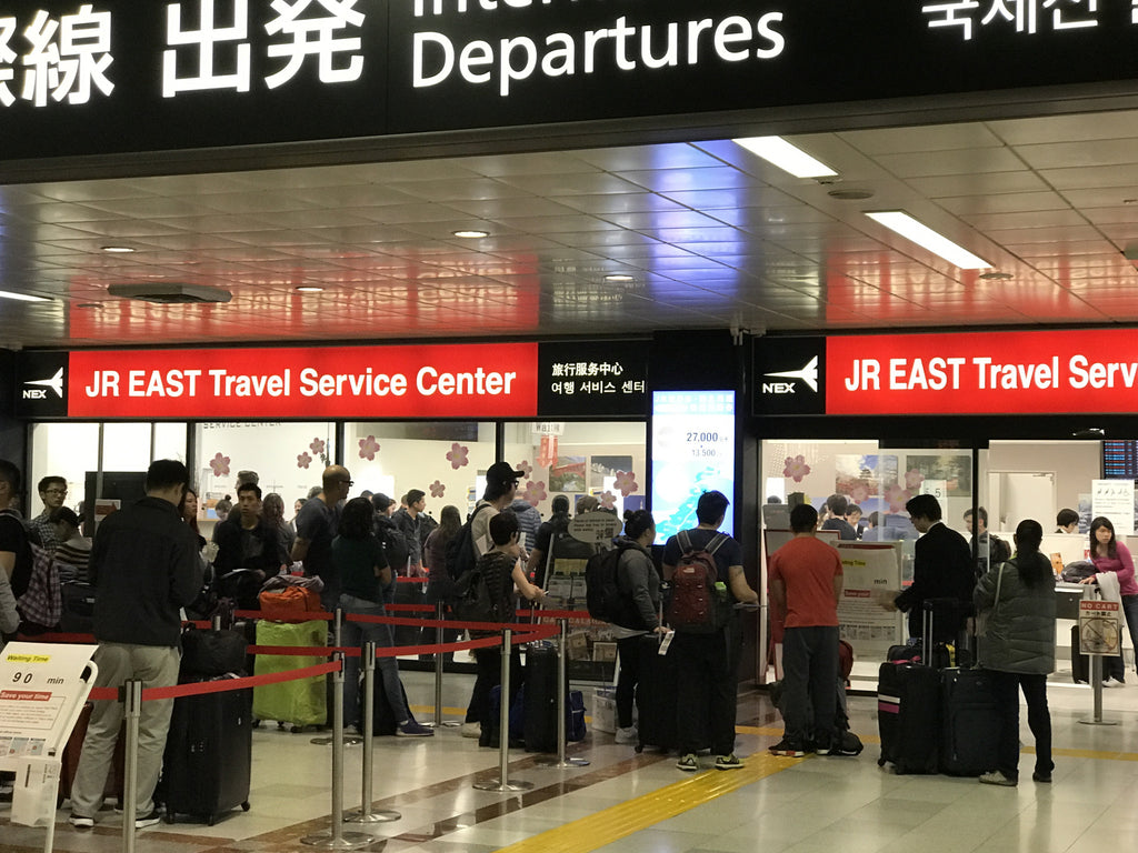 Long line at JR EAST Travel Ticket Center at Narita Airport